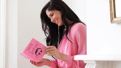 Woman Reading Birthday Card